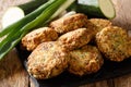 Greek zucchiniÃÂ and feta fritters Summer Light Snack close-up on a slate board. Horizontal Royalty Free Stock Photo